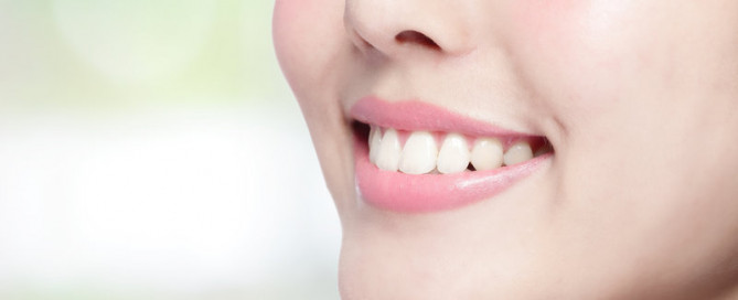 dental treatment with sedation as patient smiles